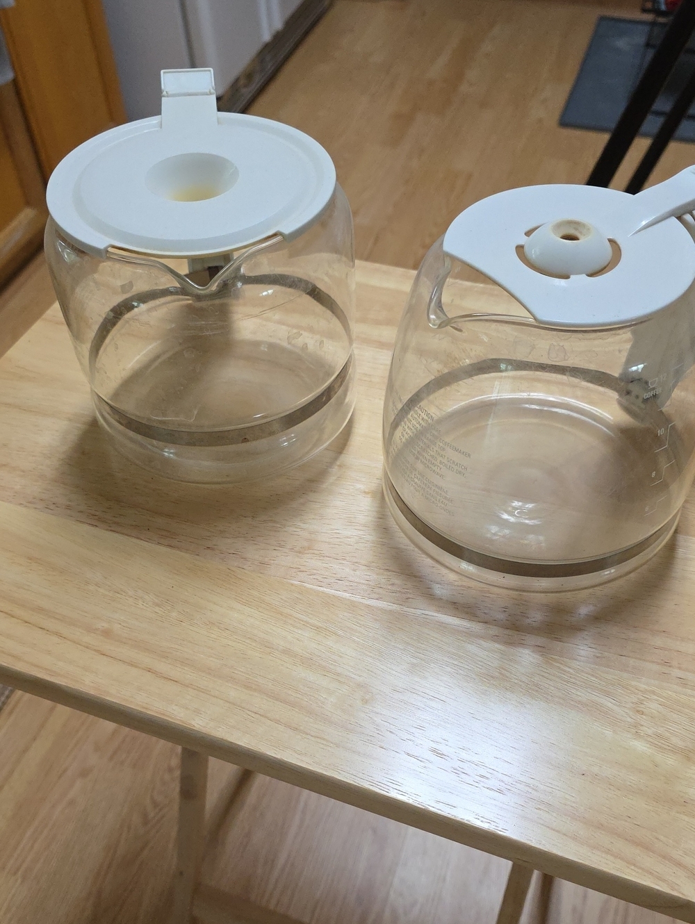 Two Clear Glass Coffee Carafes with White Lid